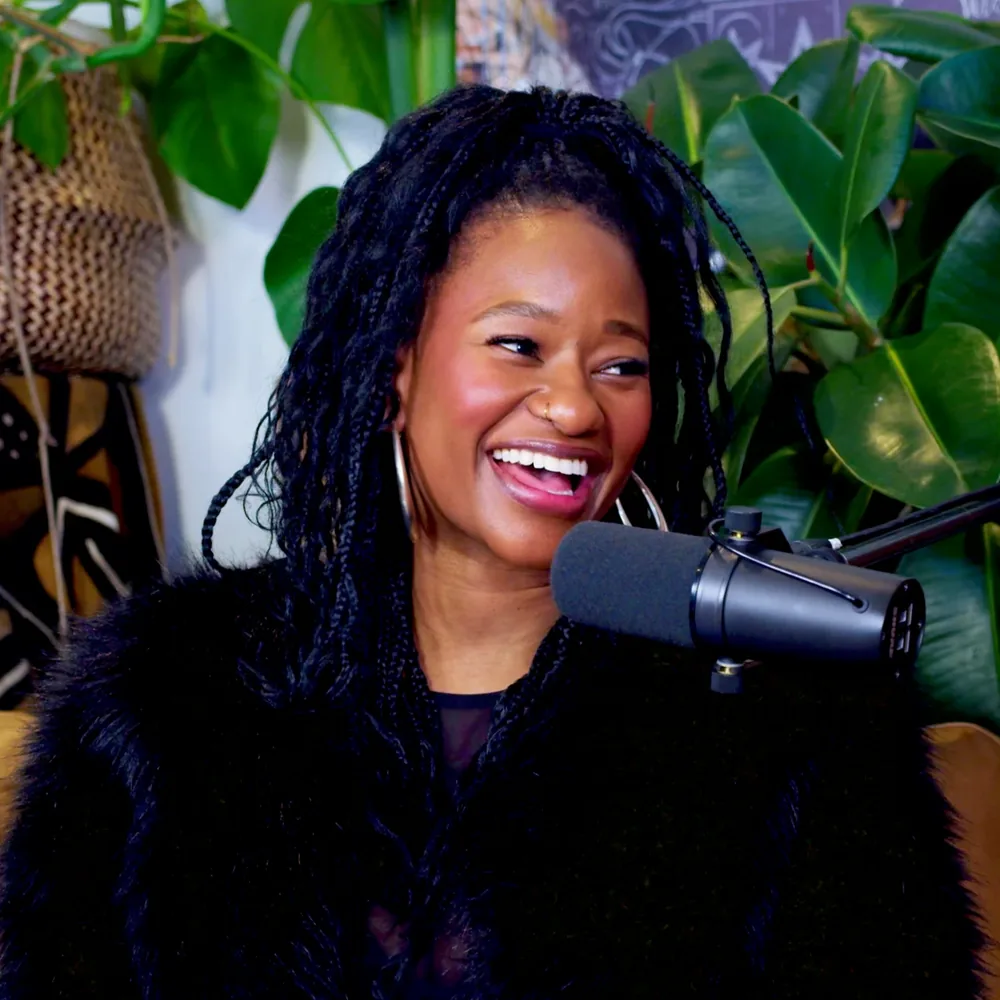 Close crop of Mati laughing at the microphone